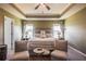 Bright bedroom with neutral tones and a comfortable seating arrangement at 13568 Scenic Pkwy, Covington, GA 30014