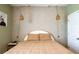 Comfortable bedroom featuring neutral walls, boho light fixtures, and a bed at 13568 Scenic Pkwy, Covington, GA 30014