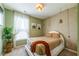 Stylish bedroom featuring an area rug, boho light fixtures, and earth-tone colors at 13568 Scenic Pkwy, Covington, GA 30014
