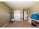 Comfortable bedroom with carpet, closet, and shelving at 13568 Scenic Pkwy, Covington, GA 30014