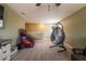 Spacious bonus room featuring a hanging chair and a basketball game at 13568 Scenic Pkwy, Covington, GA 30014