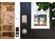 Modern front door featuring a keypad lock, sidelight window, and a decorative wreath at 13568 Scenic Pkwy, Covington, GA 30014