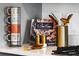 Close up image of kitchen countertop decor including a cookbook, salt & pepper shakers, and mugs at 13568 Scenic Pkwy, Covington, GA 30014