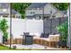 Inviting outdoor area with comfortable seating, string lights, and stylish privacy screen at 13568 Scenic Pkwy, Covington, GA 30014