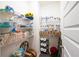 Walk-in pantry with white wire shelving and storage baskets, providing ample space for storage at 13568 Scenic Pkwy, Covington, GA 30014