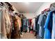 Spacious walk-in closet with ample storage and organization racks for clothing and accessories at 13568 Scenic Pkwy, Covington, GA 30014