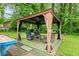 Backyard featuring a gazebo with outdoor furniture, perfect for entertaining at 211 Caboose Ln, Woodstock, GA 30189