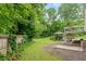 Expansive backyard with a charming gazebo, deck, and lush greenery, offering a serene outdoor living space at 211 Caboose Ln, Woodstock, GA 30189