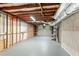 Unfinished basement with white walls, exposed ceiling, shelving and an access door at 211 Caboose Ln, Woodstock, GA 30189