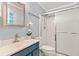 Bathroom featuring a vanity, toilet, and a shower with glass doors at 211 Caboose Ln, Woodstock, GA 30189