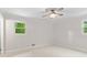 Bright, neutral bedroom with a ceiling fan and ample natural light at 211 Caboose Ln, Woodstock, GA 30189