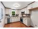 Well-lit kitchen with stainless steel appliances and elegant countertops at 211 Caboose Ln, Woodstock, GA 30189