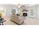 Living room with a fireplace, neutral decor, and a view of the outdoors at 211 Caboose Ln, Woodstock, GA 30189