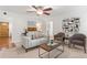 Inviting living room with a modern sofa, stylish chairs, and contemporary decor at 211 Caboose Ln, Woodstock, GA 30189