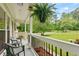 Inviting front porch with chairs and lush landscaping offering a relaxing outdoor space at 211 Caboose Ln, Woodstock, GA 30189