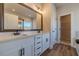 Bathroom vanity featuring double sinks, and plenty of cabinet storage at 257 Pinewood Dr, Covington, GA 30014