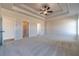 Spacious main bedroom with trey ceiling, neutral tones, and plush carpet flooring for a comfortable retreat at 257 Pinewood Dr, Covington, GA 30014