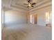 Inviting bedroom with a trey ceiling, soft carpeting, and ample space, creating a serene and restful environment at 257 Pinewood Dr, Covington, GA 30014