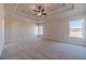 Large bedroom features a trey ceiling, ceiling fan, and large windows offering ample natural light at 257 Pinewood Dr, Covington, GA 30014