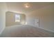 Spacious bedroom features soft carpet, a window and an access panel door at 257 Pinewood Dr, Covington, GA 30014