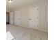 Bedroom featuring neutral carpet and white doors with black hardware throughout at 257 Pinewood Dr, Covington, GA 30014