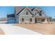 Charming two-story home with a manicured lawn, a two car garage, and a covered porch at 257 Pinewood Dr, Covington, GA 30014