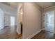 Hallway features a wood floor and multiple doors leading to other rooms of the home at 257 Pinewood Dr, Covington, GA 30014
