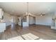 Open floor plan with hardwood floors, a fireplace, and natural light creating a welcoming atmosphere at 257 Pinewood Dr, Covington, GA 30014