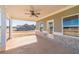Covered back patio with ceiling fan provides an outdoor living space overlooking the property at 257 Pinewood Dr, Covington, GA 30014