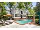 Relaxing backyard setting with a sparkling pool, sun loungers, and a beautiful patio, creating an ideal space for recreation at 277 Alberta Ne Dr, Atlanta, GA 30305