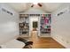 Bonus room with hardwood floors, built-in bookshelves and black chaise lounge at 277 Alberta Ne Dr, Atlanta, GA 30305