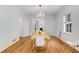 Light-filled dining room featuring hardwood floors, a chandelier, and ample space for entertaining guests at 277 Alberta Ne Dr, Atlanta, GA 30305