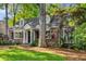 Charming brick home with mature landscaping and a well-maintained front yard at 277 Alberta Ne Dr, Atlanta, GA 30305