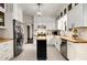 This kitchen features white cabinets, butcher block counters, stainless steel appliances, and an island at 277 Alberta Ne Dr, Atlanta, GA 30305
