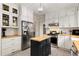 This kitchen has white cabinets, butcher block counters, stainless steel appliances, and a mobile island at 277 Alberta Ne Dr, Atlanta, GA 30305