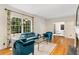 Bright living room with large windows, hardwood floors, and stylish furnishings at 277 Alberta Ne Dr, Atlanta, GA 30305