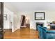 Inviting living room with hardwood floors, fireplace, and view of the home's staircase at 277 Alberta Ne Dr, Atlanta, GA 30305