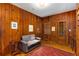 Classic office with wood-paneled walls, rug and built-in shelving at 277 Alberta Ne Dr, Atlanta, GA 30305