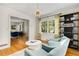 Bright sitting room with a pair of armchairs, hardwood floors, and lots of natural light at 277 Alberta Ne Dr, Atlanta, GA 30305