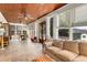Relaxing sunroom with tiled floors, multiple windows providing natural light, and comfortable furniture at 277 Alberta Ne Dr, Atlanta, GA 30305