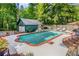 Beautiful pool area includes patio seating, and lush greenery, offering a perfect spot for entertaining or unwinding at 277 Alberta Ne Dr, Atlanta, GA 30305