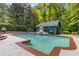 Inviting backyard pool with a well-maintained patio and a decorative water feature, perfect for a tranquil outdoor lifestyle at 277 Alberta Ne Dr, Atlanta, GA 30305
