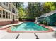 Beautiful backyard swimming pool with patio, lounge chairs, and lush landscaping, perfect for relaxation and outdoor entertaining at 277 Alberta Ne Dr, Atlanta, GA 30305
