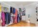 Bright walk-in closet with custom shelves, hanging racks, and a dressing area with a full-length mirror on the door at 277 Alberta Ne Dr, Atlanta, GA 30305