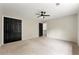 A spacious bedroom features neutral paint, carpeting, black doors, and a ceiling fan at 3060 Robertswood Dr, Powder Springs, GA 30127