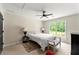 Bright bedroom featuring a bed, a window, carpeting, and neutral paint at 3060 Robertswood Dr, Powder Springs, GA 30127