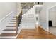 Elegant foyer with hardwood floors, staircase, and detailed molding at 3060 Robertswood Dr, Powder Springs, GA 30127