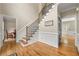 Entryway featuring hardwood floors and classic white wainscoting at 3060 Robertswood Dr, Powder Springs, GA 30127