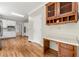 Modern kitchen design with adjacent desk and cabinet area at 3060 Robertswood Dr, Powder Springs, GA 30127