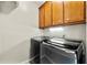Efficient laundry room features modern appliances and functional cabinets for easy organization at 3060 Robertswood Dr, Powder Springs, GA 30127